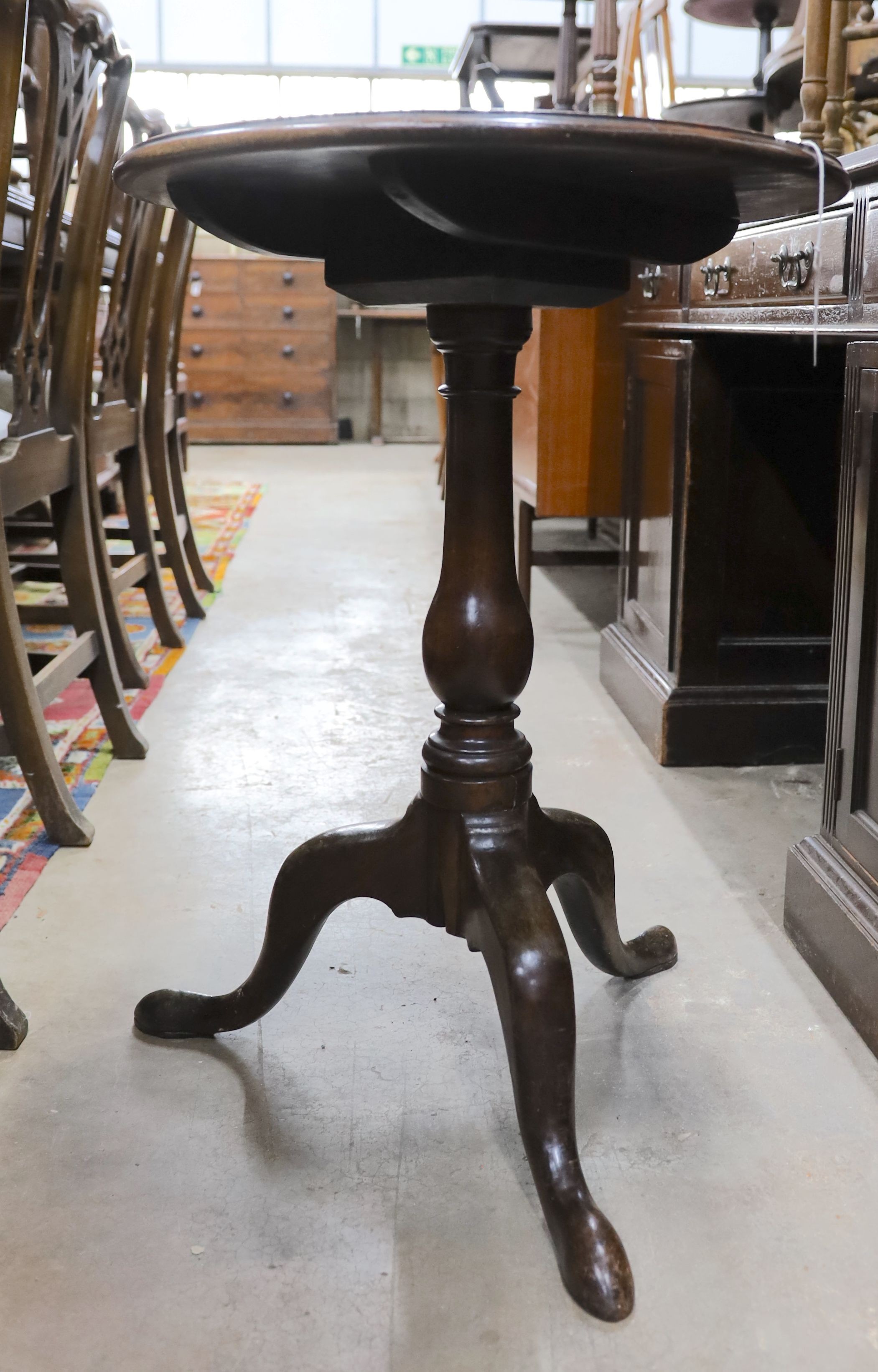 A George III mahogany circular tilt top tripod table, diameter 50cm, height 70cm